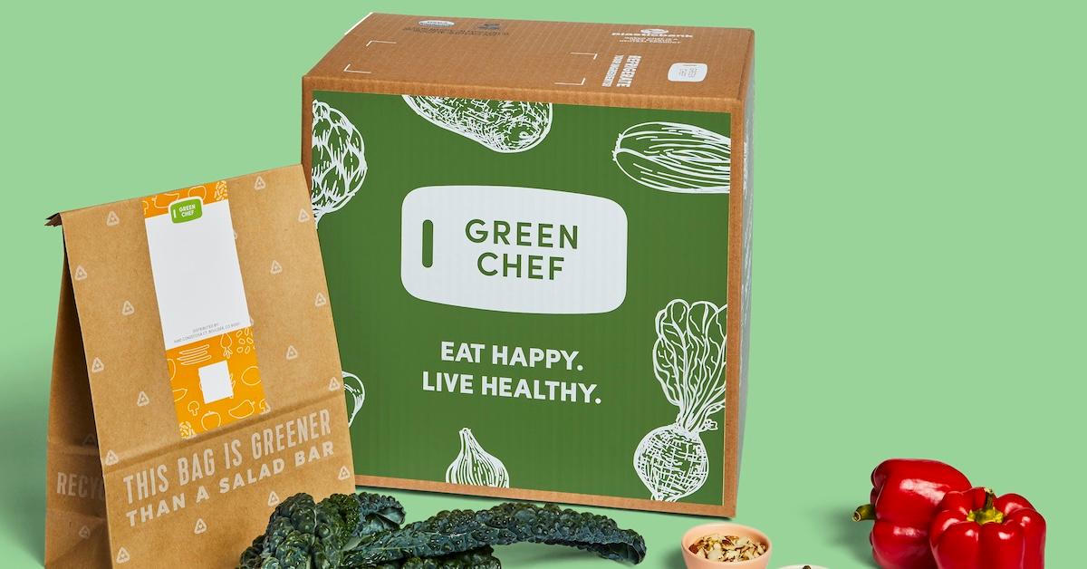 Green Chef box and bag with some vegetables on green background